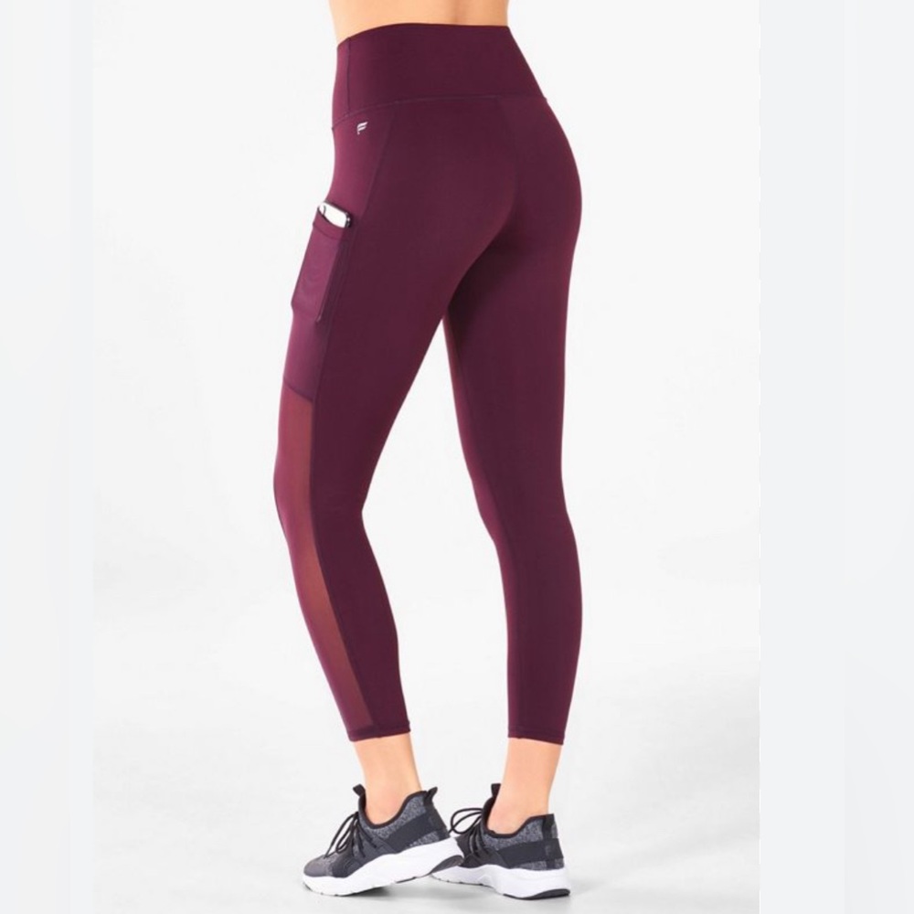 Fabletics Powerhold 7/8 high waisted leggings with sheer side panel and pockets.